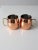 This is a pair of vintage Godinger copper mugs. The Moscow Mule mug set feature stainless steel interiors with brass handles.