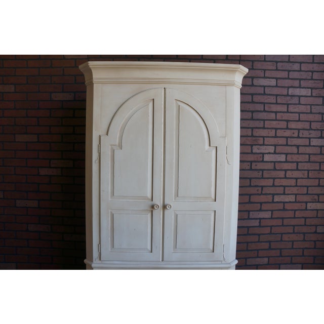 Inspired by a New England antique, this corner china cabinet by Ethan Allen is an impressive style statement. With...