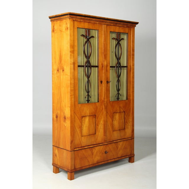 Biedermeier bookcase with interesting decorative moulding southern germany / austria cherry biedermeier circa 1825...