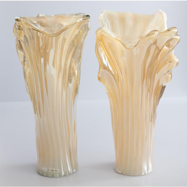 A large stylish pair of Mid-Century Italian Murano soft amber gold art glass vases. Maker's label "Murano Made in Italy"...