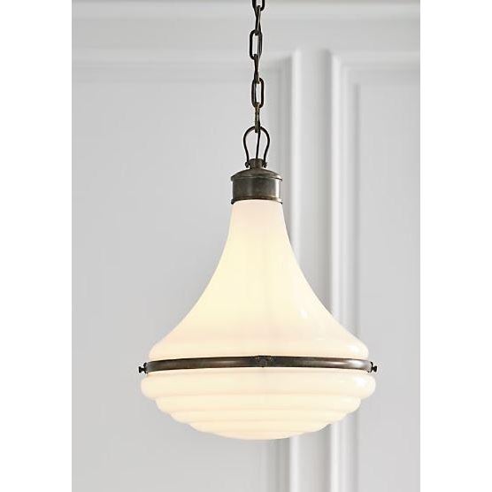 Desginer Amber Lewis Westley 15" Pendant in Bronze Finish and White Glass. Specifications: Height: 19.75" Width: 14.75"...