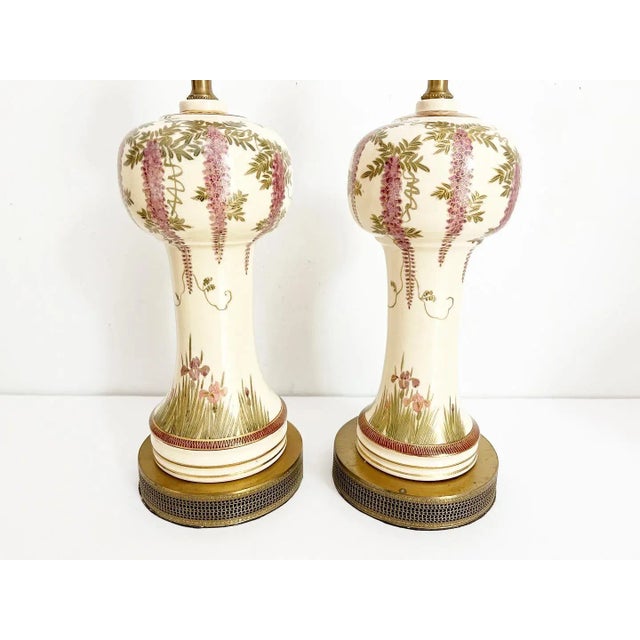 Gorgeous and rare pair of antique Japanese vase lamps from the Meiji period featuring baluster-style bodies in a creamy...