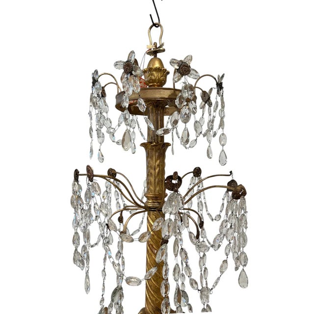 An impressive 18th century Genoese chandelier, handcrafted in Italy and showcasing the elegant artistry of the Genovese...