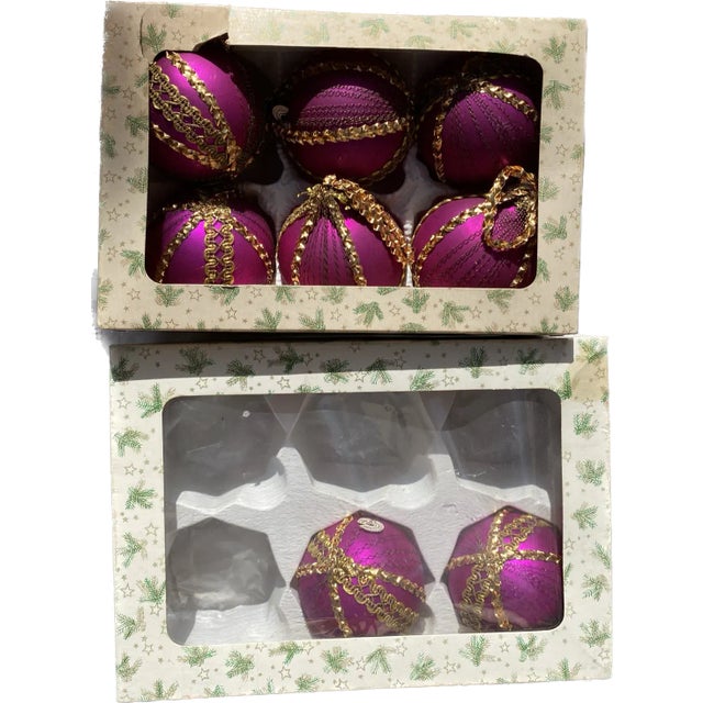 8 glass ball ornaments in original boxes. Beautifully made pink with gold braid decoration.