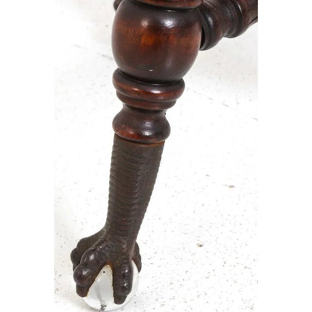 A very good, sold wood, adjustable (screw height mechanism) piano stool. The stool is well made and has brass ball and...