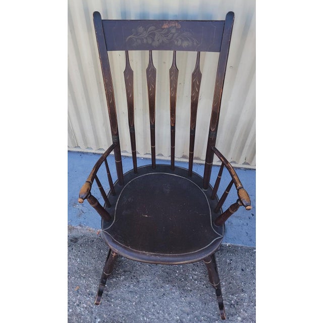 This very fine example of early New England paint decorated arrow back Windsor rocking chair is so finely done and...
