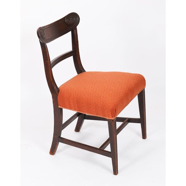 This is an elegant set of four english regency period flame mahogany dining chairs, circa 1820 in date. The set comprises...