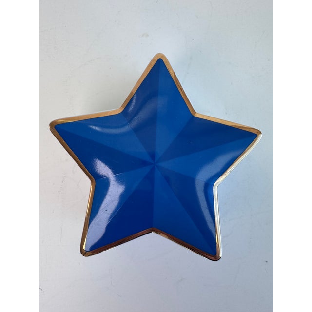 A five pointed star box to keep your dresser treasures. The bi colored blue star is outlined in gold. There is a signature...