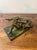 An elegant and finely detailed bronze sculpture by Louis Chalon depicting a reclining nude woman in the intimate act of...