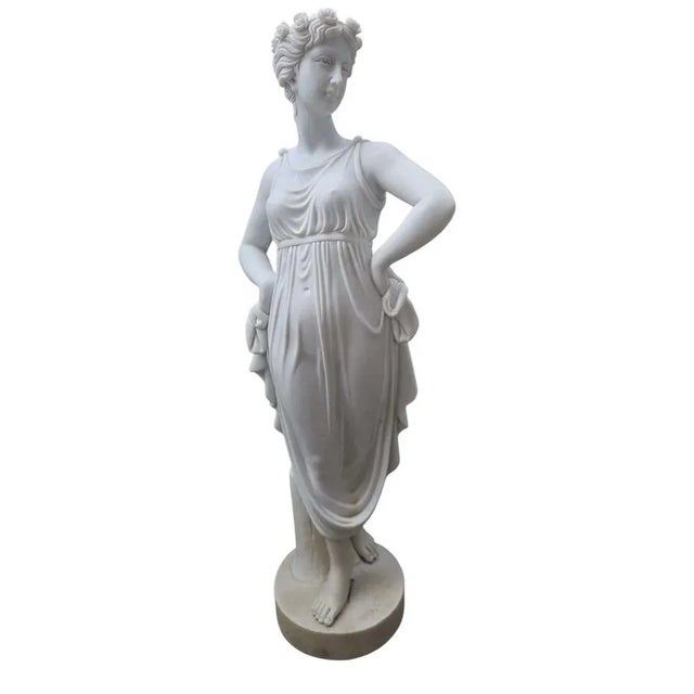 Elegant hand-carved marble sculpture made in Italy during the 20th century, depicting a graceful young woman in 19th-...