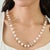 This late 20th-century style station necklace features 222.67 carats of round pearls, each measuring approximately 8 mm,...