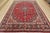 This authentic semi-antique traditional Mashad rug is hand-knotted with fine wool and natural dyes. This oriental rug...