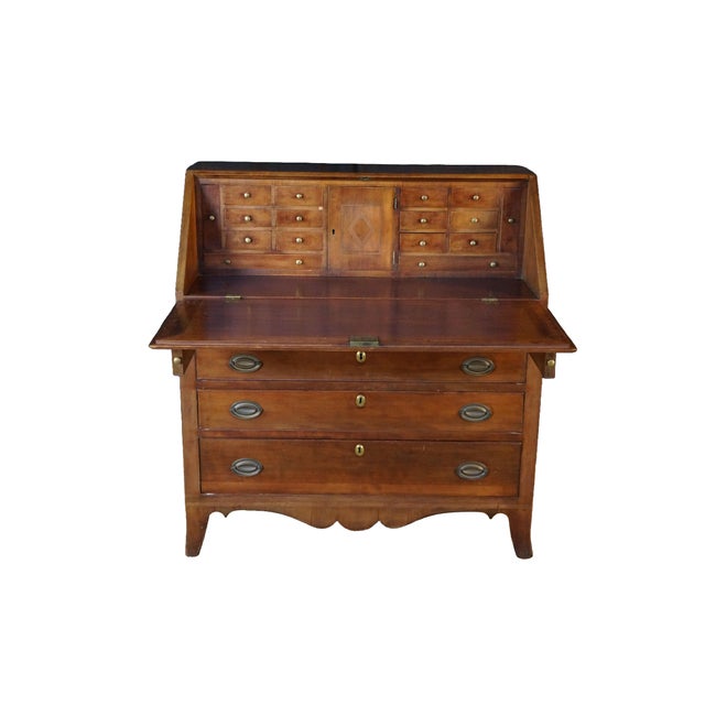 This antique American Federal period Hepplewhite slant-front desk is meticulously crafted from warm, richly grained...