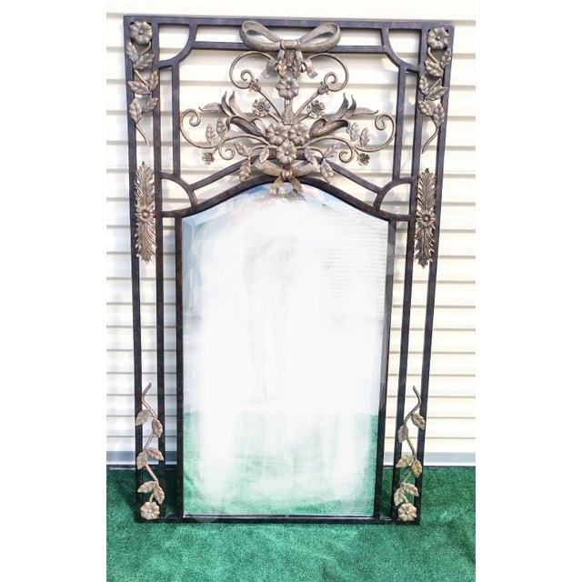 An incredible very rare massive mirror by La Barge. The mirror features extremely heavy iron surround with highly...