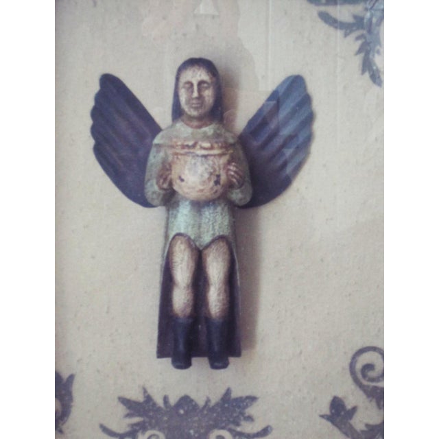 Vintage Mexican Retable with Angel. Metal box with glass front an carved wood Angel on the inside. It measures 13"H x 11"W...