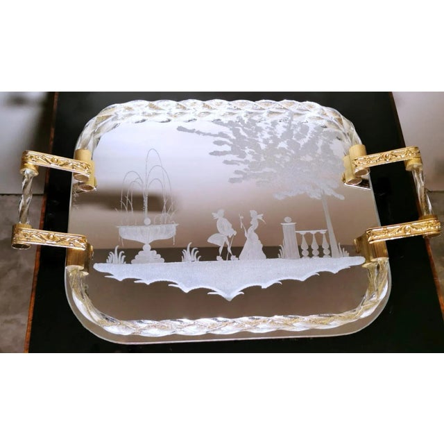 Iconic vanity tray with handles; the rectangular top is a mirror with rounded corners and has been skilfully ground with...