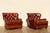 Exceptional pair of vintage Churchill club chairs by Henredon from the 1990s, upholstered in rich distressed brown leather...