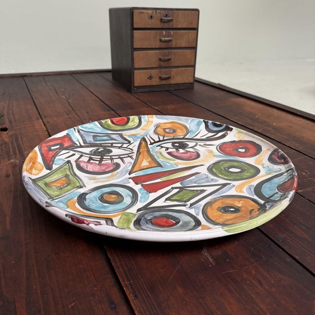 A large and expressive ceramic plate from seminara in calabria, italy, made by gennaro condurso. a unique handmade piece,...