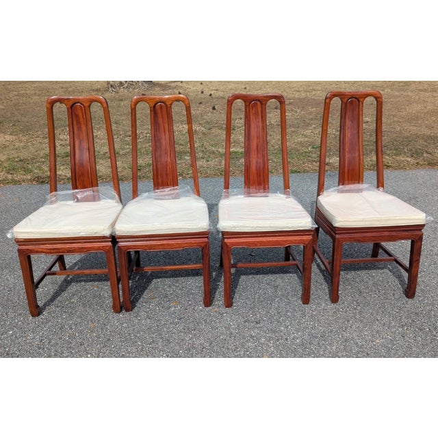 Set of 8 Asian-Style rosewood dining chairs with upholstered padded removable cushions. Included 6 side chairs and 2 arm...