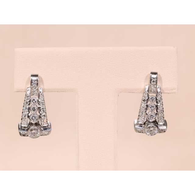 A sophisticated example of Art Deco design, The Gianna earrings are beautifully crafted in platinum and set with a...