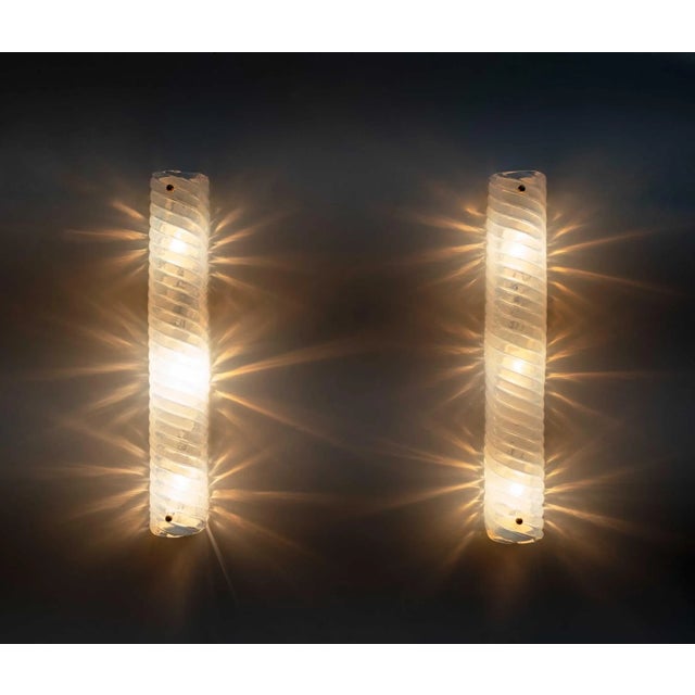 Eight changing vintage wall lamps in Lattiginoso Murano glass, produced by Murano Masters. These are of high quality and...