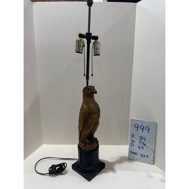 Sculptural bird figure table lamp on a black pedestal base with standard lamp socket cluster and pull chains. Strong...