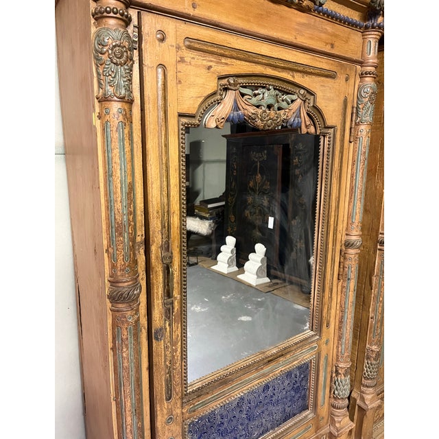 Intricately Hand Carved Soft Colored Motifs on Entire exterior. Antique Mirrored Glass and Stained Glass. Single Brass...