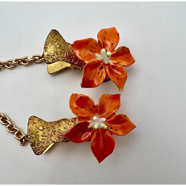 This fabulous 1950s England Enamel Flowers on Chain Scarf Clip / Sweater Guard is just the finishing touch your outfit...