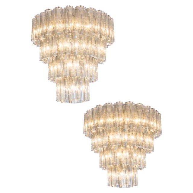 Pair Italian vintage chandeliers in Murano glass and nickel plated metal structure on 4 levels. The armor polished nickel...