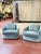 A stylish pair of vintage barrel-back lounge chairs newly upholstered in luxurious designer velvet. Featuring gracefully...