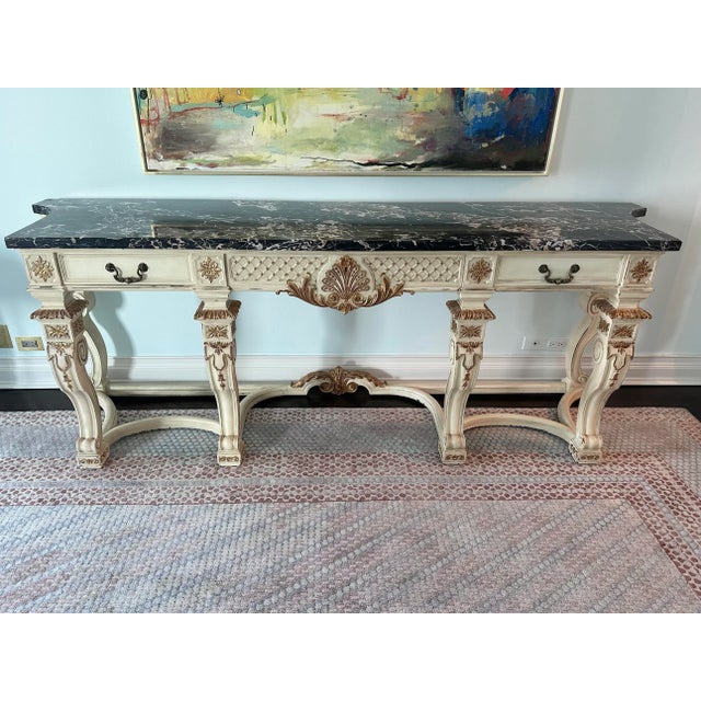 Elegant Louis XV style marble top console / sideboard attributed to Maison Jansen, circa 1930s. The 91” wide monumental...