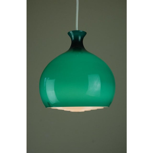 Green onion-shaped hand-blown incamiciato glass lampshade. Clear blue-green on the outside, white opal inside. Round...