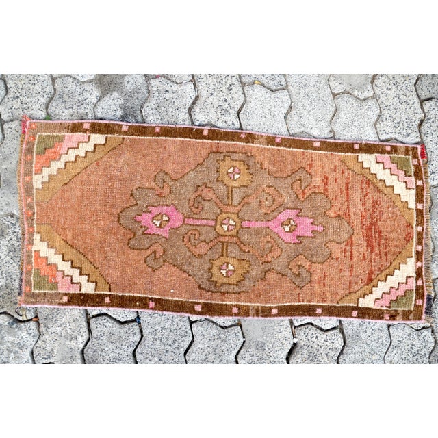 This is a vintage Turkish Oushak rug from the 1960s. The piece was hand-knotted.