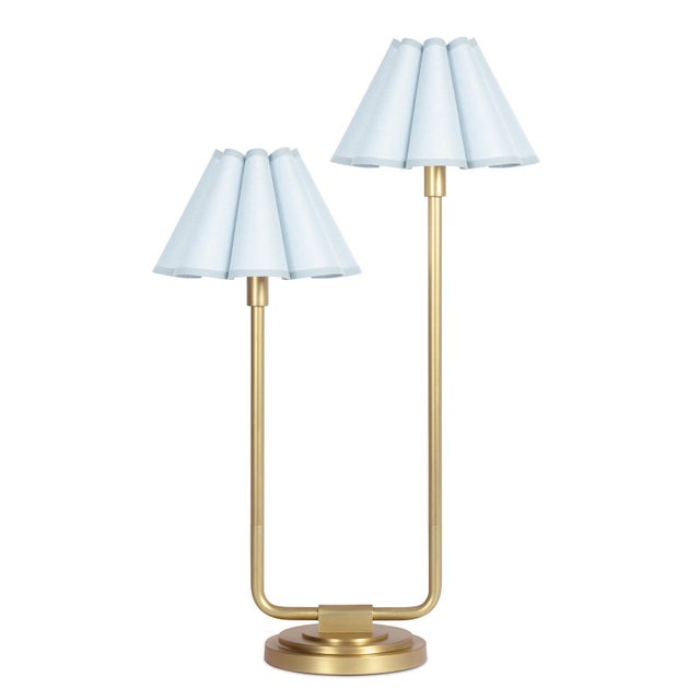 An imaginative twist on a classic style, the Polly Double Arm Table Lamp reaches upward with twin scalloped shades that...
