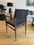 A refined “Ledermann” armchair designed by Tom Kelley for Enrico Pellizzoni, showcasing the brand’s signature...