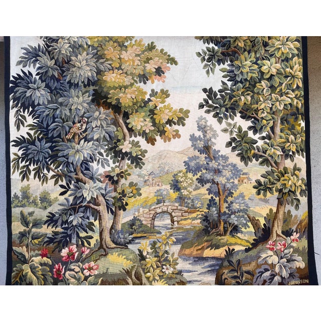 Beautiful Aubusson tapestry depicting a serene pastoral landscape with a winding river, picturesque bridge, distant...