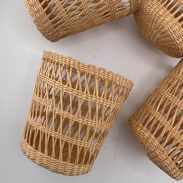A beautifully crafted set of six vintage woven rattan wicker glass holders, showcasing the effortless charm of coastal...
