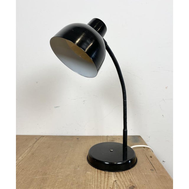 Industrial workshop table lamp made in Poland during the 1960s.It features a black metal base and shade and a black...