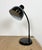 Industrial workshop table lamp made in Poland during the 1960s.It features a black metal base and shade and a black...
