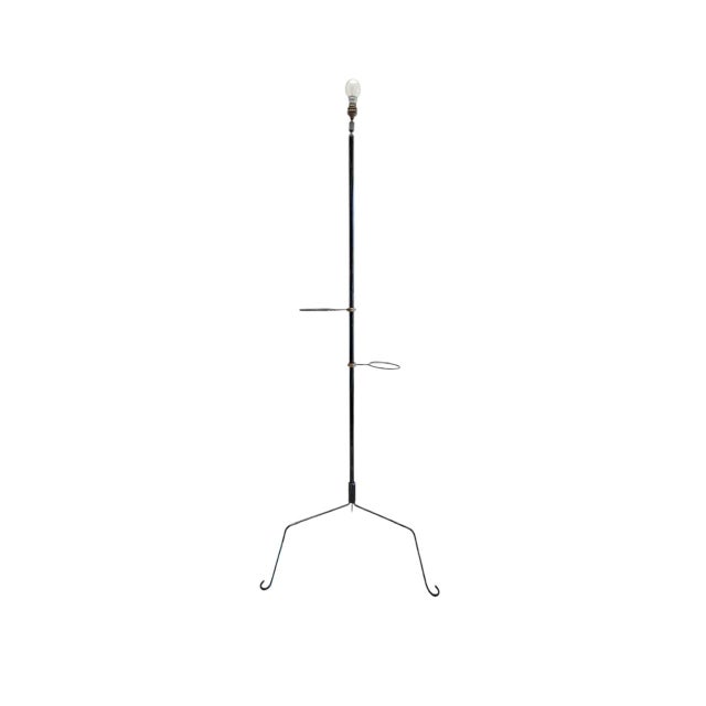 French mid-century tripod floor lamp made of black lacquered metal with two flowerpot holders. The lamp has the original...