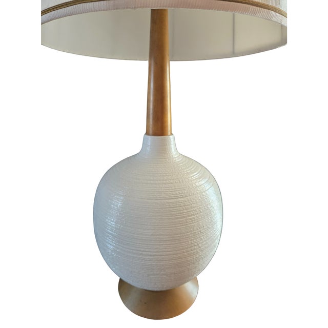 Mid-Century Modern Danish style table lamp. A round gourd shape in white high-gloss porcelain with a textured finish. Teak...