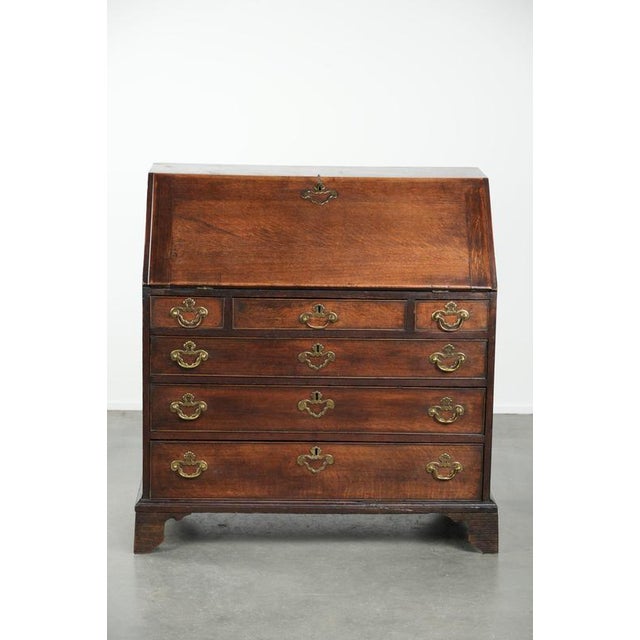 We are offering this beautiful 18th-century English antique secretary desk, crafted from oak with original hardware and 6...