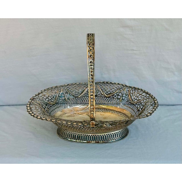 An exceptionally rare and elegant 18th century English sterling silver cake basket by Burrage & Davenport, dating to circa...