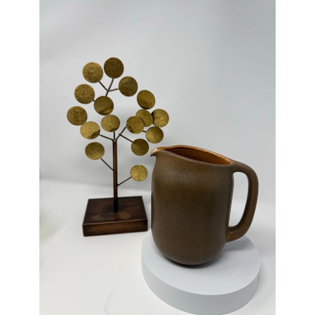 Designed by Edith Heath for Heath Ceramics, this vintage stoneware pitcher possibly dates to the 1960s and features the...