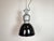 Industrial black enamel pendant light made by Elektrosvit in former Czechoslovakia during the 1960s. White enamel inside...