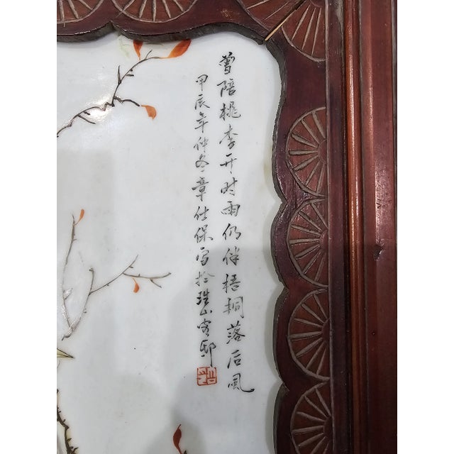 A are pair of mid 20th Century Chinese Famille Rose Porcelain Plaques in Carved Wood Frames. Measures 12.5" in width,...
