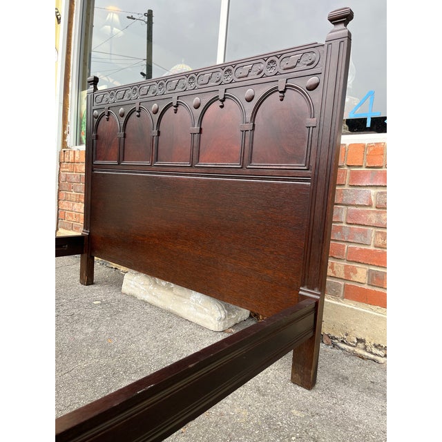 Beautiful Jacobean Revival full size bed Attributed to John Widdicomb Furniture Co. Features panelled headboard with...