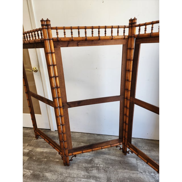 Presenting an exceptional 19th-century Aesthetic Movement tri-fold frame, masterfully crafted from solid mahogany. Dating...