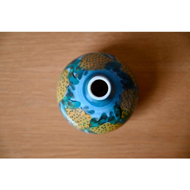 This small, round, handcrafted ceramic vase comes straight from Corfu. Its compact, round shape, topped with a narrow...