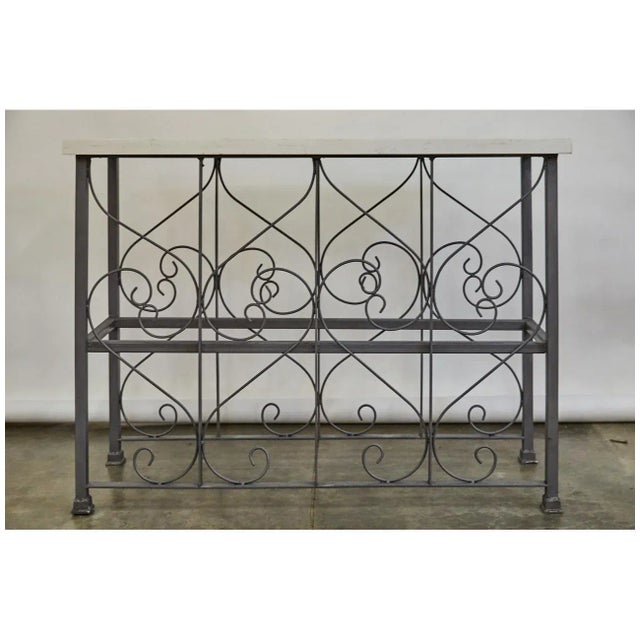 This console table is of a nice height with a marble top. The iron base has been sandblasted, oiled and waxed. The piece...